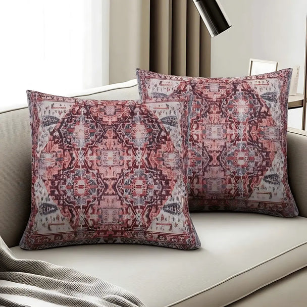 Patterned pillows on a sofa with a neutral background