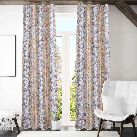 Paisley print curtains in neutral living room with white chair