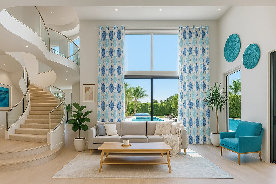 Elegant living room with teal accents and spiral staircase.
